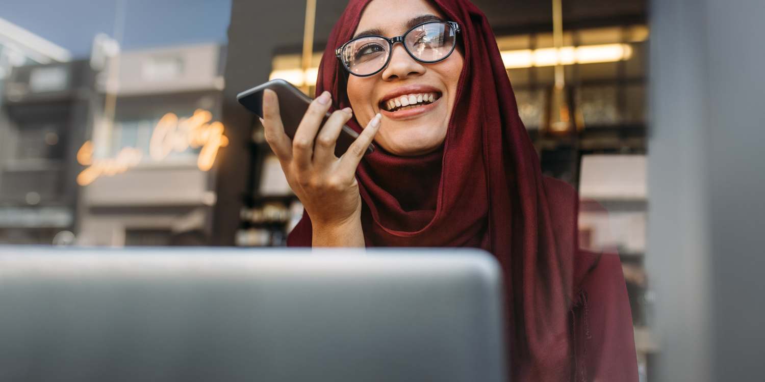 Woman In Hijab With Mobile And Laptop